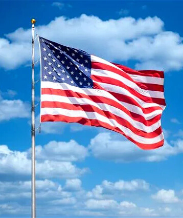 American Flag Flying before a Blue Sky