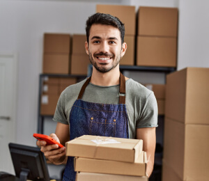 business owner holding boxes