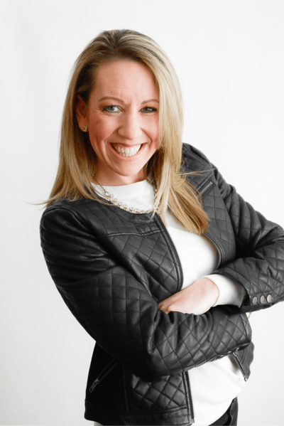 Jill O’Boyle smiling confidently in a professional headshot; dynamic executive coach known for helping professionals overcome burnout and reclaim purpose.