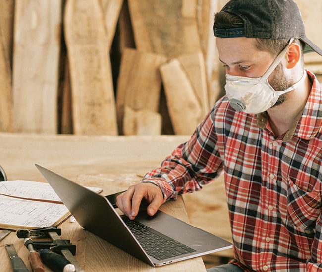 Business Owner Checking His Line of Credit on Computer