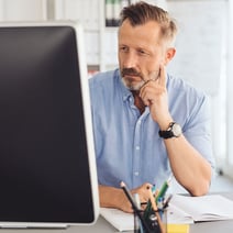 Man looking at business CD balance online
