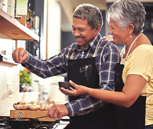 Happy Couple Enjoying Cooking