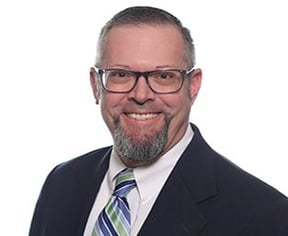 photo of mark walker in a suit on a white background